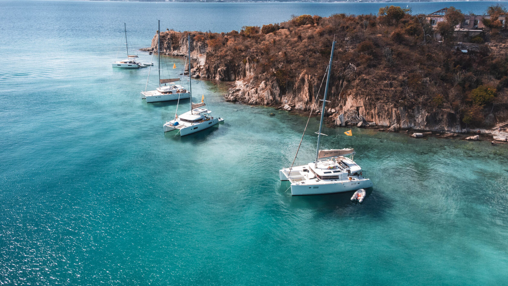Yachts docket in a bay.