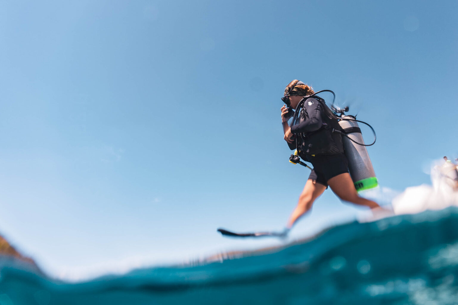 Diver jumping into the water.