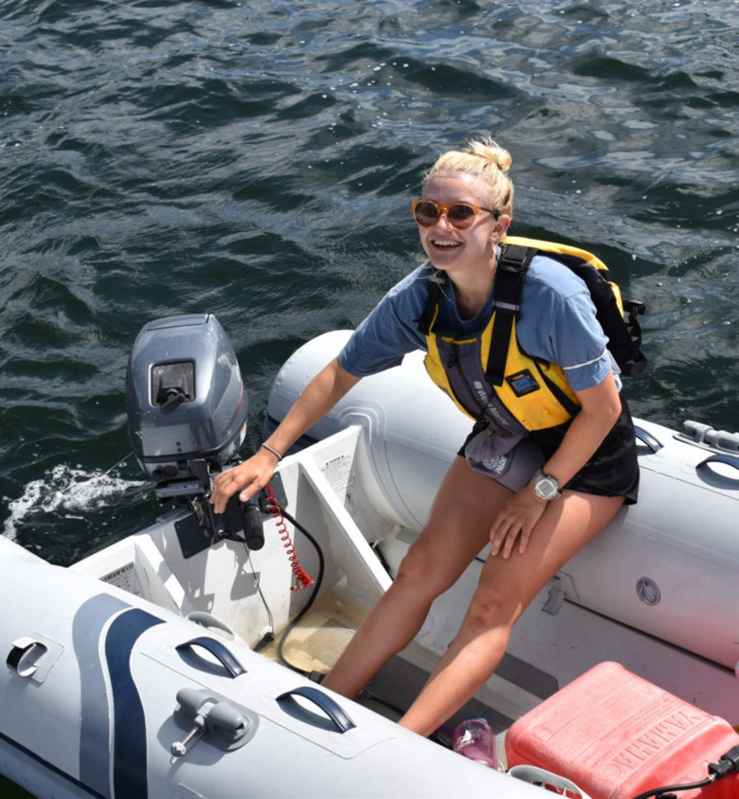Working driving a small dingy boat.