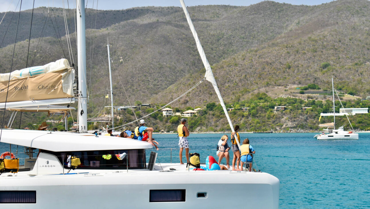 A white sailboat in the water.